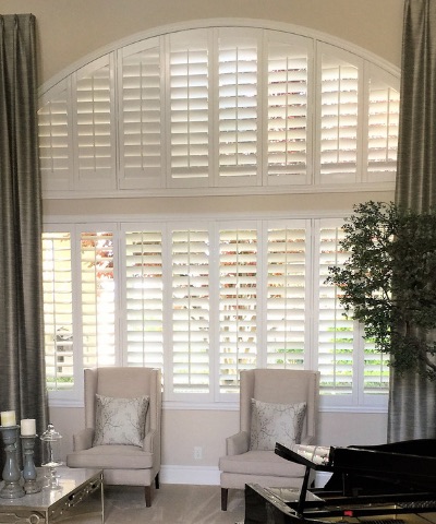 Plantation shutters on an arched window